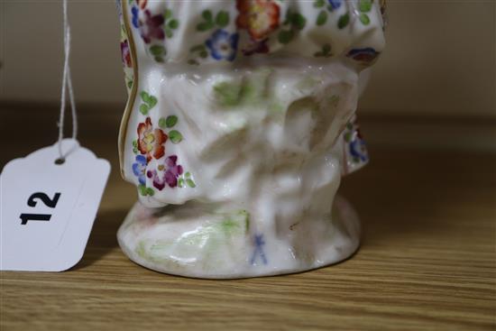 A Continental porcelain figure of a flower seller, a Satsuma teapot and cover and two dishes